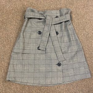 Inner tag was ripped off accidentally. But it is a Saks Fifth Avenue skirt.